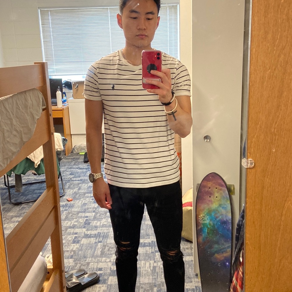 White and black striped Polo shirt. Size medium.